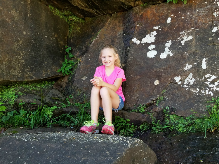 A Father's Perspective. Image of daughter posing on rocks.