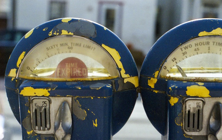 Avoiding Parking Tickets, Image of two beat up parking meters