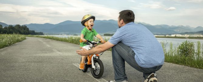 Father and son on the bicycle outdoor