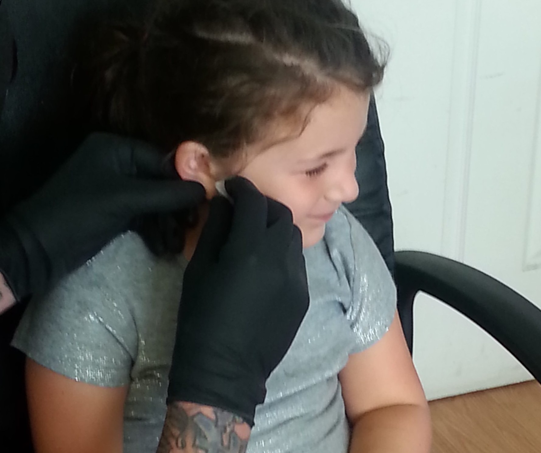 Ear Piercing at a Tattoo Parlor