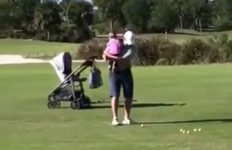 Golf Dad Introduces His Baby To Golf As He Works On His Short Game